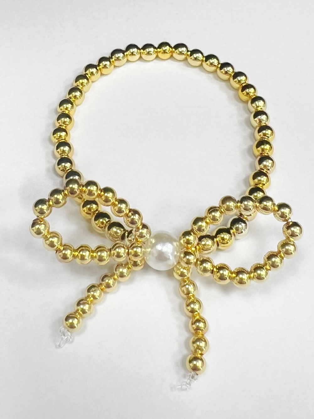 Gold Beaded Bow Stretch Bracelet with Pearl Accent